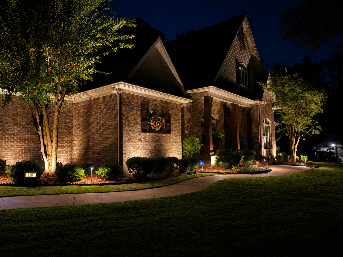 Chapel building with comprehensive facade and landscape uplighting