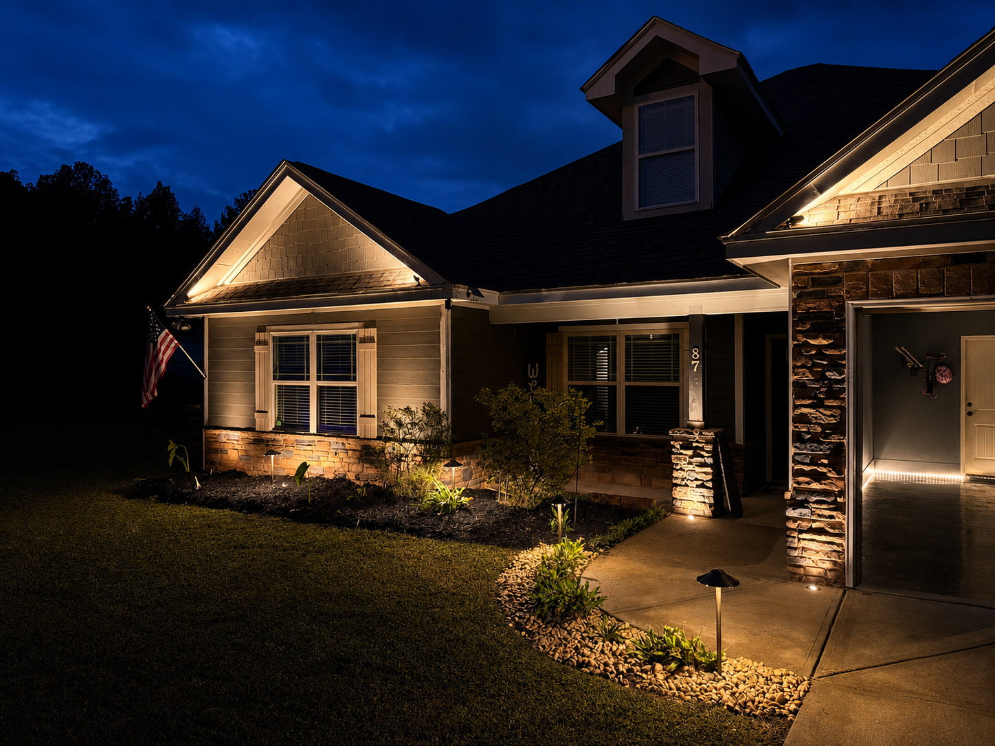 Modern home facade with integrated patio uplighting